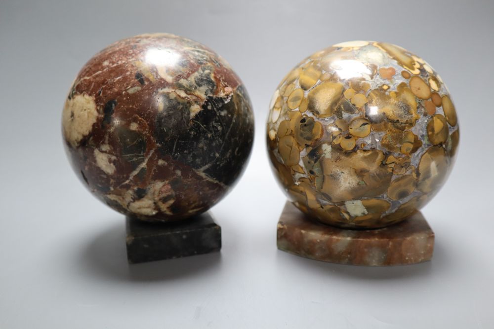 Four marble balls on stands